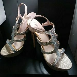 Gold high heel shoes